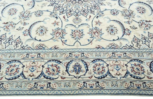 Corner detail of 2000s Nain rug showing border pattern and Wool pile