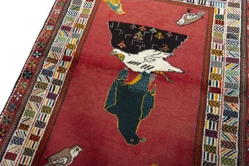 Backside of handmade 2000s Persian Gabbeh rug showing knot structure and weave density