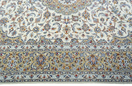 Corner detail of 2000s Kashan rug showing border pattern and Wool pile
