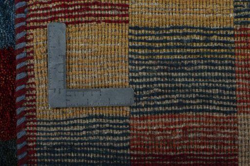 Close-up detail of 2000s Persian Gabbeh rug from Pakistan showing Wool weave