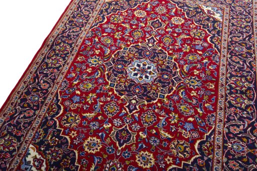 Backside of handmade 2000s Kashan rug showing knot structure and weave density
