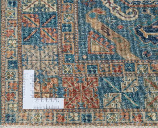 Corner detail of New Kazak rug showing border pattern and Wool pile