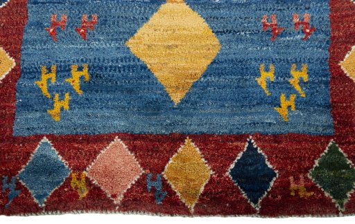 Central medallion detail of 2000s Persian Gabbeh rug from Pakistan