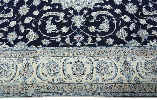 Corner detail of New Nain rug showing border pattern and Wool pile