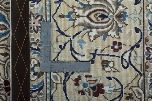 Backside of handmade New Nain rug showing knot structure and weave density