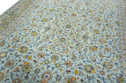 Backside of handmade 2000s Kashan rug showing knot structure and weave density