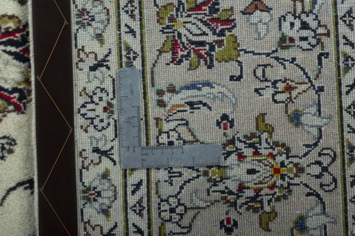 Backside of handmade 2000s Kashan rug showing knot structure and weave density