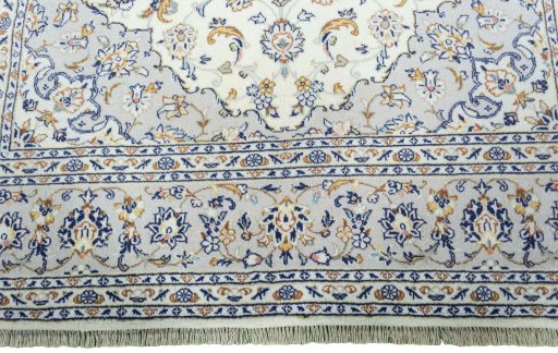 Full view of New Kashan rug from Iran / Persia, 298 × 202 cm in Beige tones