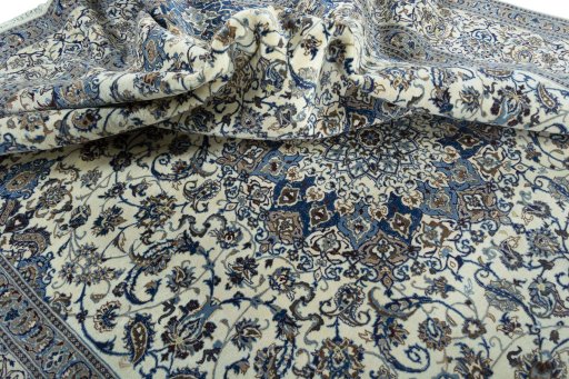Surface texture of 2000s Nain rug with natural Wool and intricate pattern