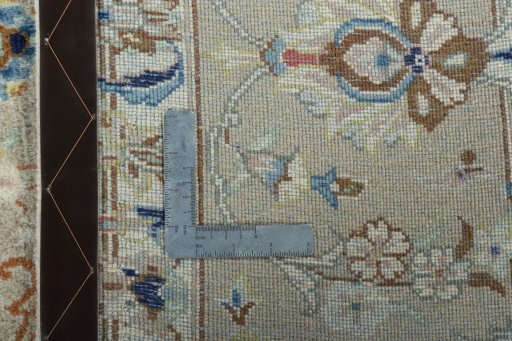 Backside of handmade New Kashan rug showing knot structure and weave density