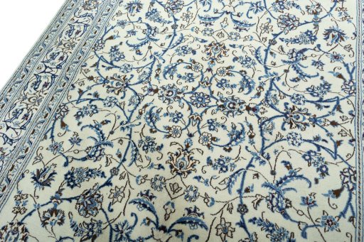 Backside of handmade 2000s Nain rug showing knot structure and weave density