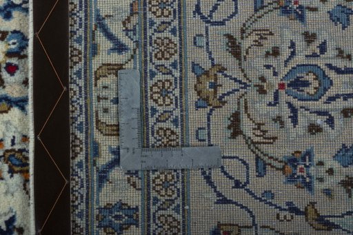 Backside of handmade 2000s Kashan rug showing knot structure and weave density