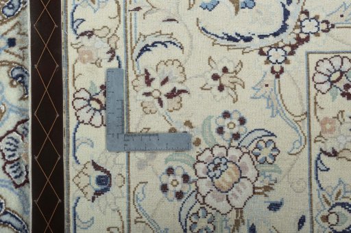 Backside of handmade 2000s Nain rug showing knot structure and weave density