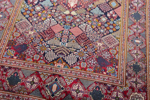 Close-up detail of 2000s Kashan rug from Iran / Persia showing Wool weave