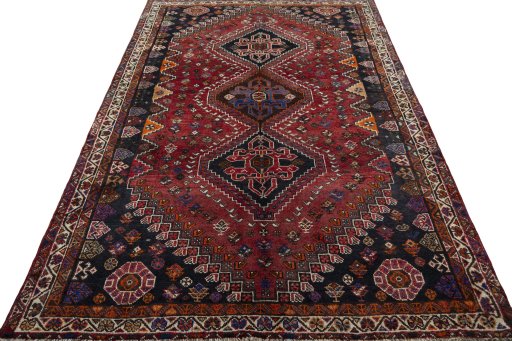 Surface texture of 2000s Shiraz rug with natural Wool and intricate pattern