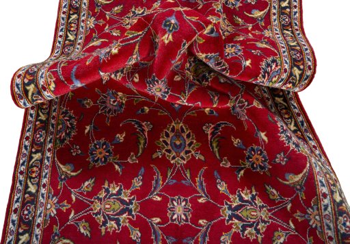 Close-up detail of 2000s Kashan rug from Iran / Persia showing Wool weave
