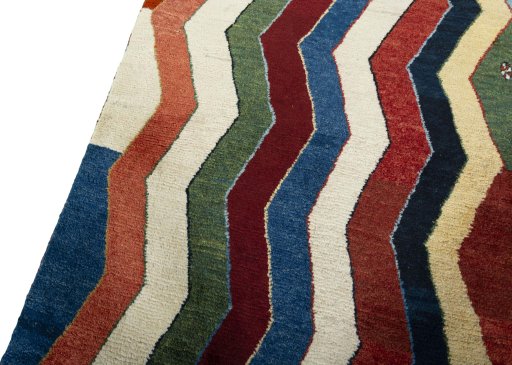 Backside of handmade 2000s Persian Gabbeh rug showing knot structure and weave density