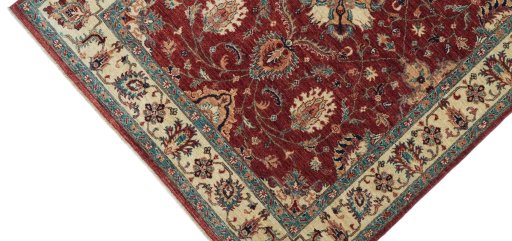 Backside of handmade New Farahan rug showing knot structure and weave density