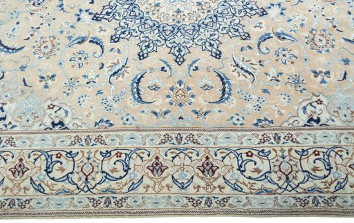 Corner detail of 2000s Nain rug showing border pattern and Wool pile