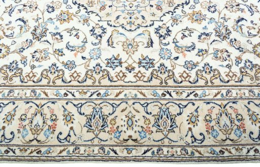 Corner detail of 2000s Kashan rug showing border pattern and Wool pile