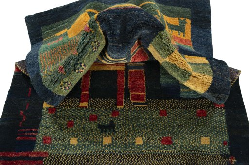 Corner detail of 2000s Persian Gabbeh rug showing border pattern and Wool pile