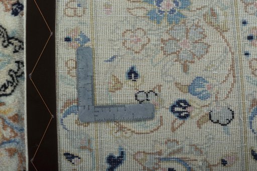 Backside of handmade New Kashan rug showing knot structure and weave density