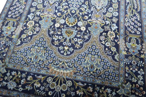 Close-up detail of 2000s Kashan rug from Iran / Persia showing Wool weave