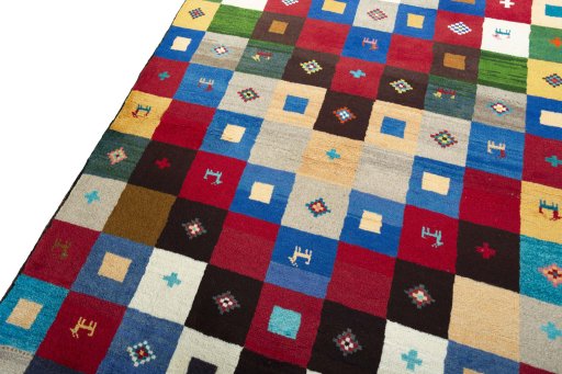 Backside of handmade 2000s Persian Gabbeh rug showing knot structure and weave density