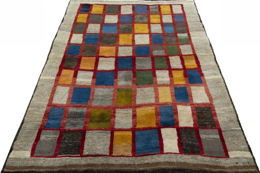 Surface texture of 2000s Persian Gabbeh rug with natural Wool and intricate pattern