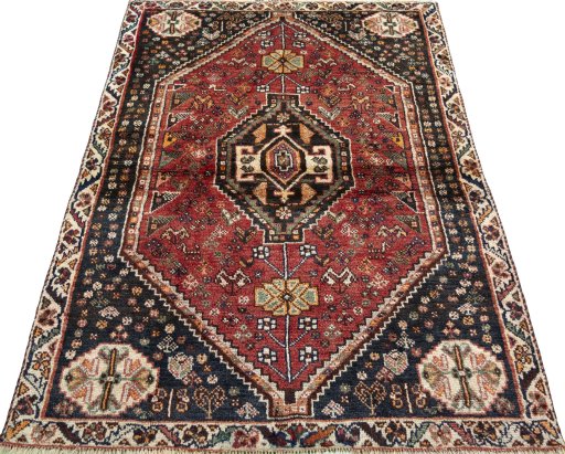 Surface texture of 2000s Shiraz rug with natural Wool and intricate pattern