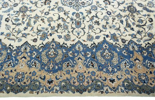 Corner detail of 2000s Kashan rug showing border pattern and Wool pile