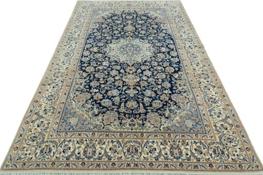 Surface texture of 2000s Nain rug with natural Wool and intricate pattern