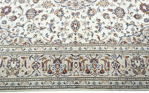 Corner detail of 2000s Kashan rug showing border pattern and Wool pile