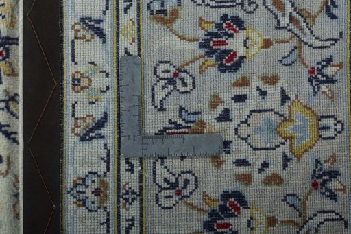 Backside of handmade 2000s Kashan rug showing knot structure and weave density