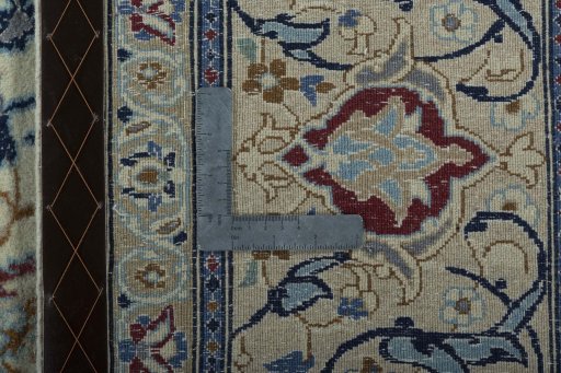 Backside of handmade 2000s Nain rug showing knot structure and weave density