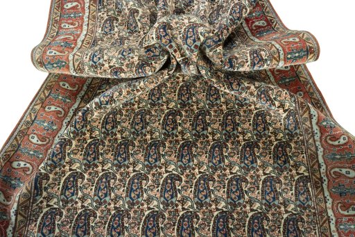 Corner detail of 1950s Ghom rug showing border pattern and Wool pile