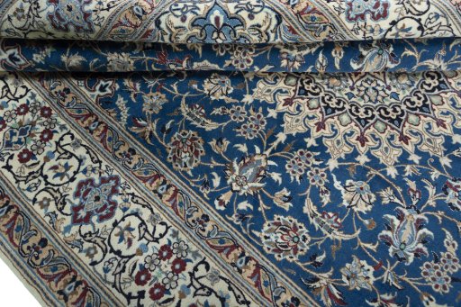 Close-up detail of 2000s Nain rug from Iran / Persia showing Wool weave