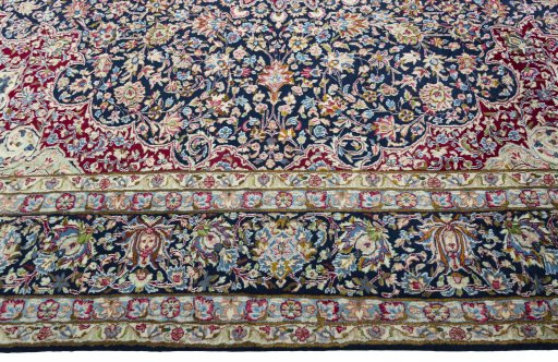 Corner detail of 1970s Kerman rug showing border pattern and Wool pile