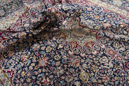 Surface texture of 1970s Kerman rug with natural Wool and intricate pattern