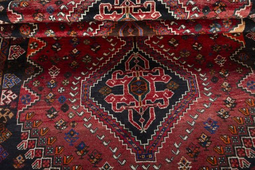 Full view of 2000s Shiraz rug from Iran / Persia, 258 × 165 cm in Red tones
