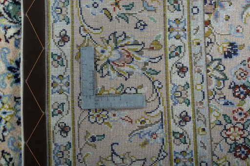 Backside of handmade New Kashan rug showing knot structure and weave density