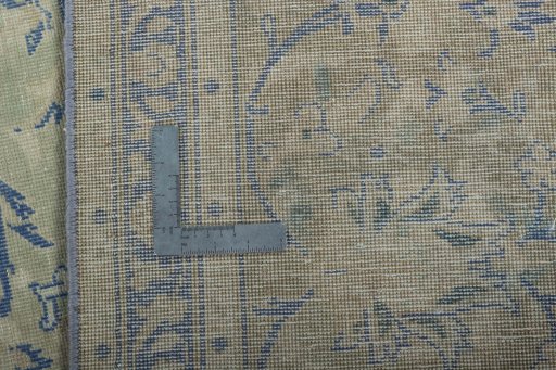Surface texture of 1970s Vintage rug with natural Wool and intricate pattern