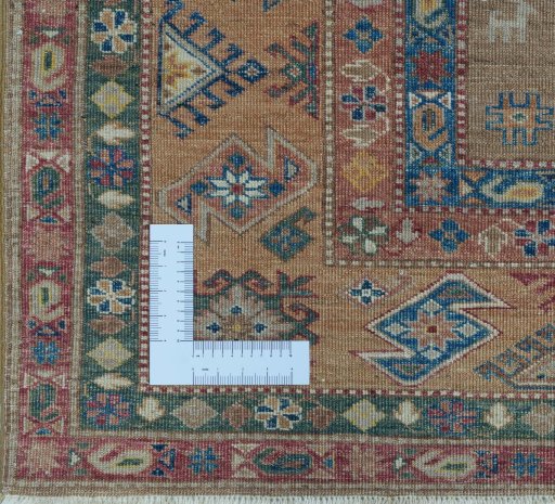 Corner detail of New Kazak rug showing border pattern and Wool pile