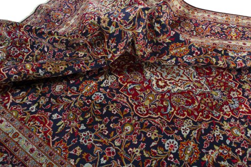 Surface texture of 2000s Kashan rug with natural Wool and intricate pattern