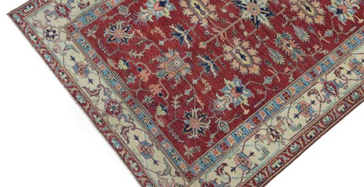 Backside of handmade New Farahan rug showing knot structure and weave density