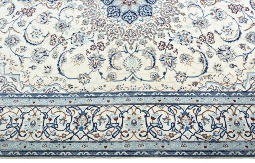 Corner detail of New Nain rug showing border pattern and Wool pile