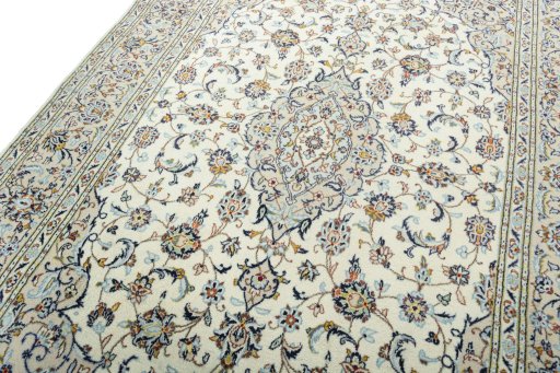 Backside of handmade 2000s Kashan rug showing knot structure and weave density