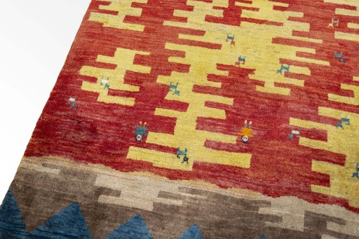 Backside of handmade 2000s Persian Gabbeh rug showing knot structure and weave density