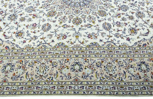 Corner detail of 2000s Kashan rug showing border pattern and Wool pile