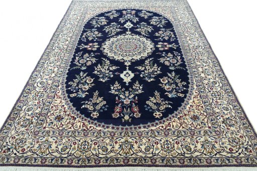 Surface texture of 2000s Nain rug with natural Wool and intricate pattern